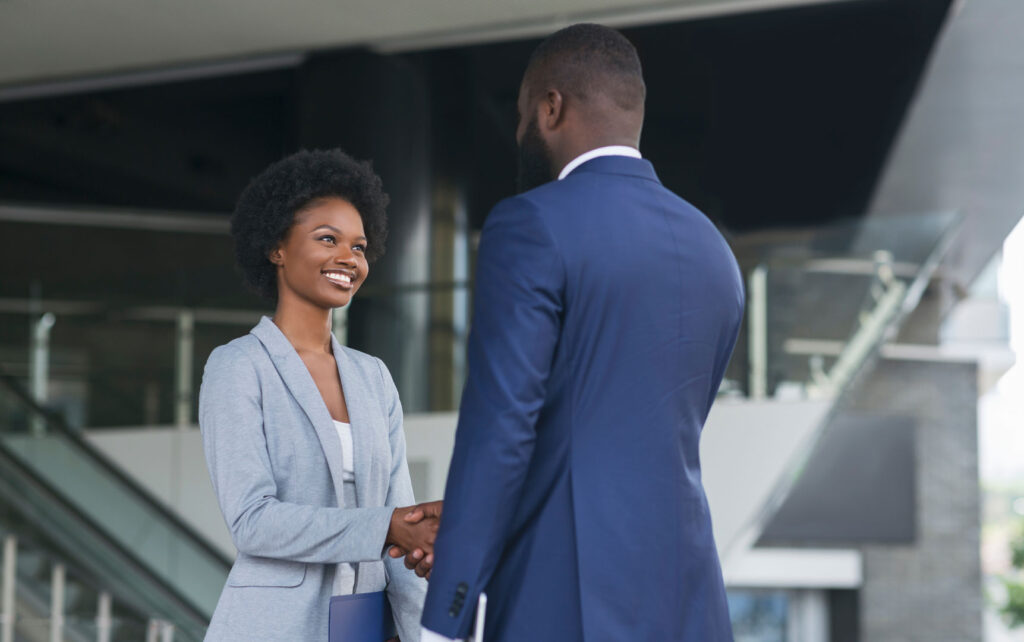 hired two professionals shaking hands